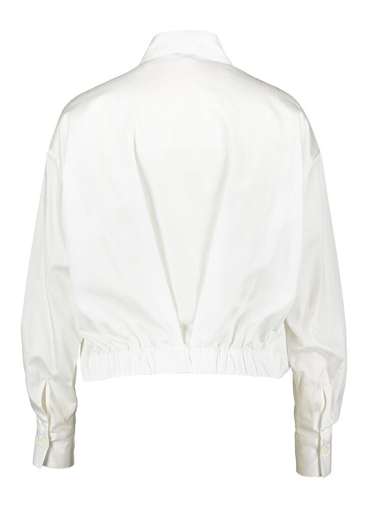 Wit geklede bloes Hidem Gigue