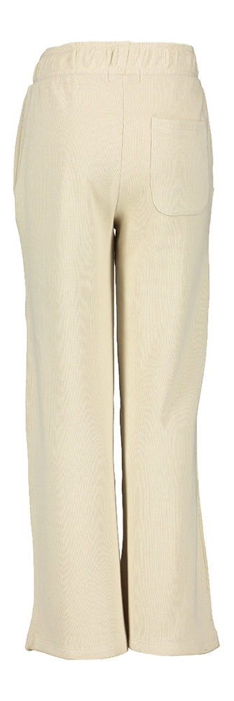 Pantalon-pull couleur sable en tissu côtelé. Nom