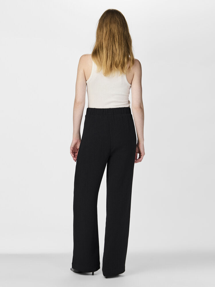 Pantalon noir fluide et ample à plis Yaskia TAS