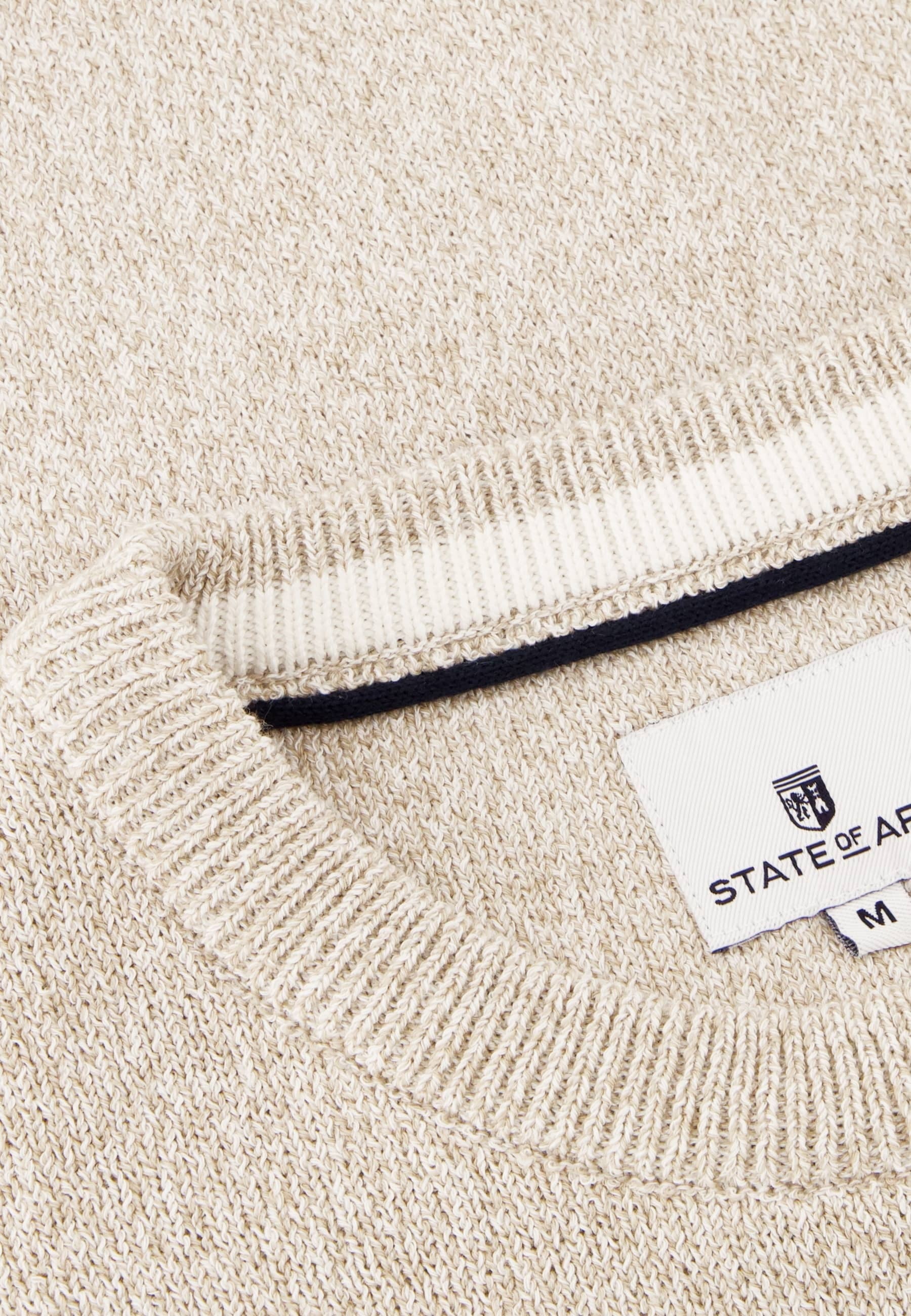 Pull beige à col rond et logo de la marque sur la manche State Of Art