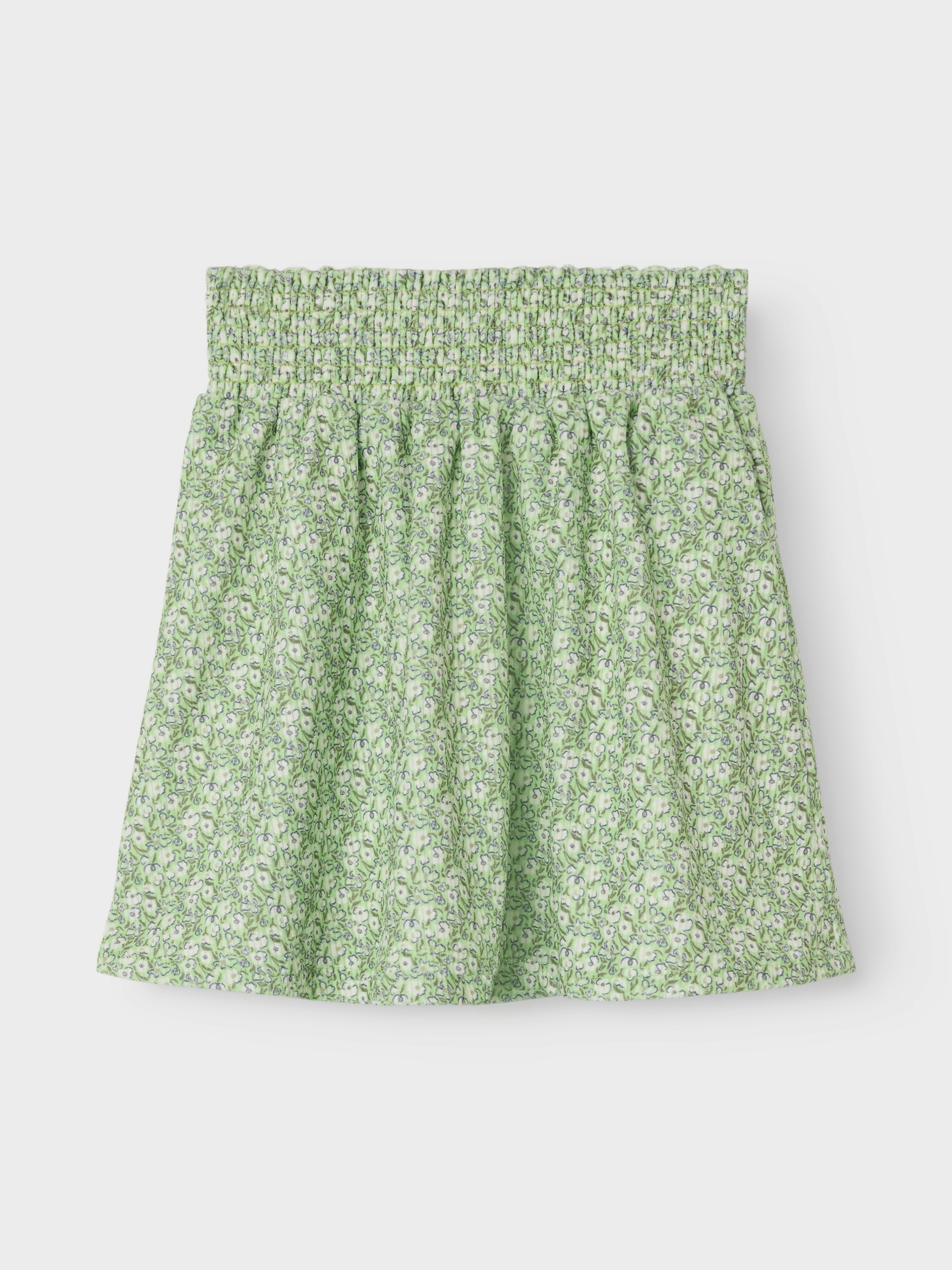 Jupe courte verte à motifs floraux. Nommez-la