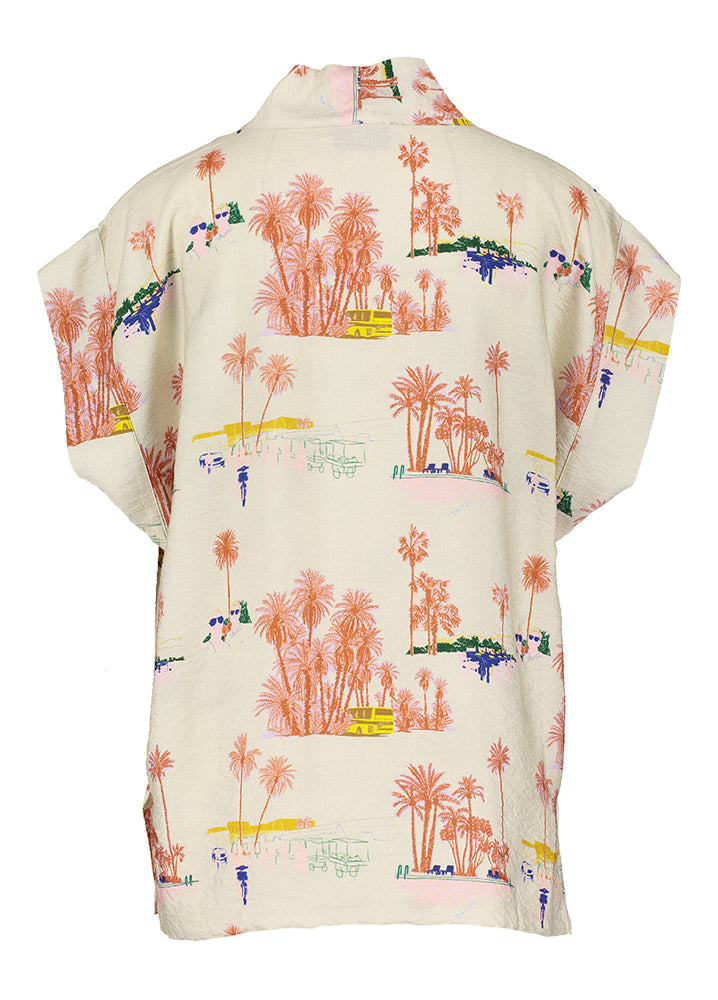 Blouse beige à col V et palmiers par Nathalie Vleeschouwer