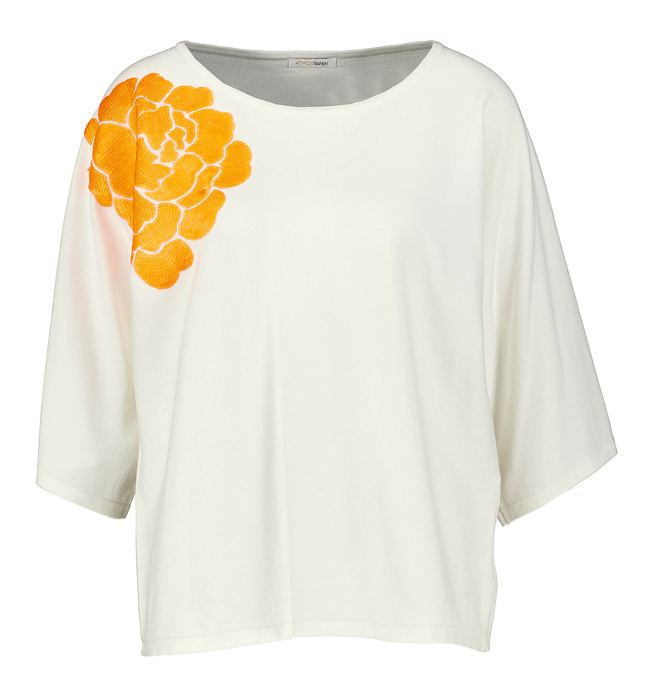 Witte pull met oranje pailletten detail Sika Atmos
