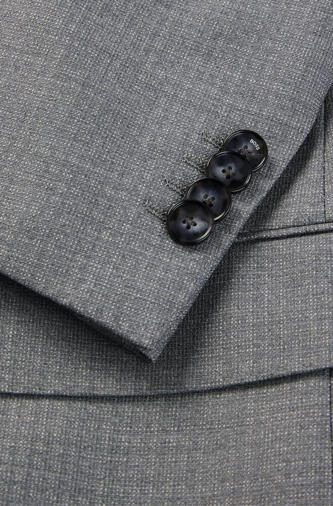 Costume deux pièces gris à motif discret, style Hugo Boss.