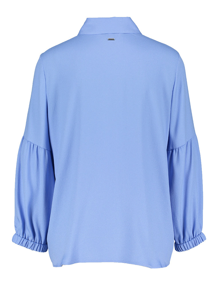 Chemisier bleu clair avec détail sur la manche Hansa Xandres