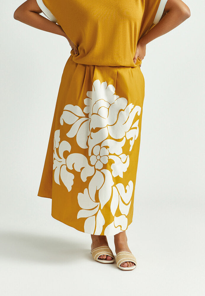 Jupe plissée jaune ocre à imprimé floral blanc Rila Xandres