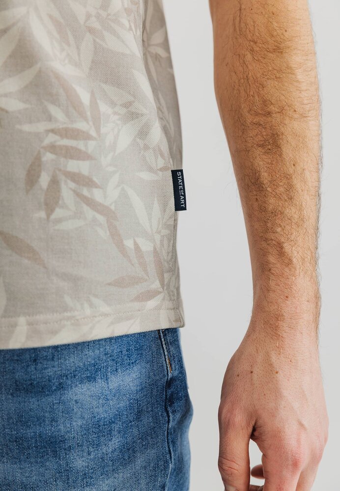 Polo beige avec imprimé de pointe