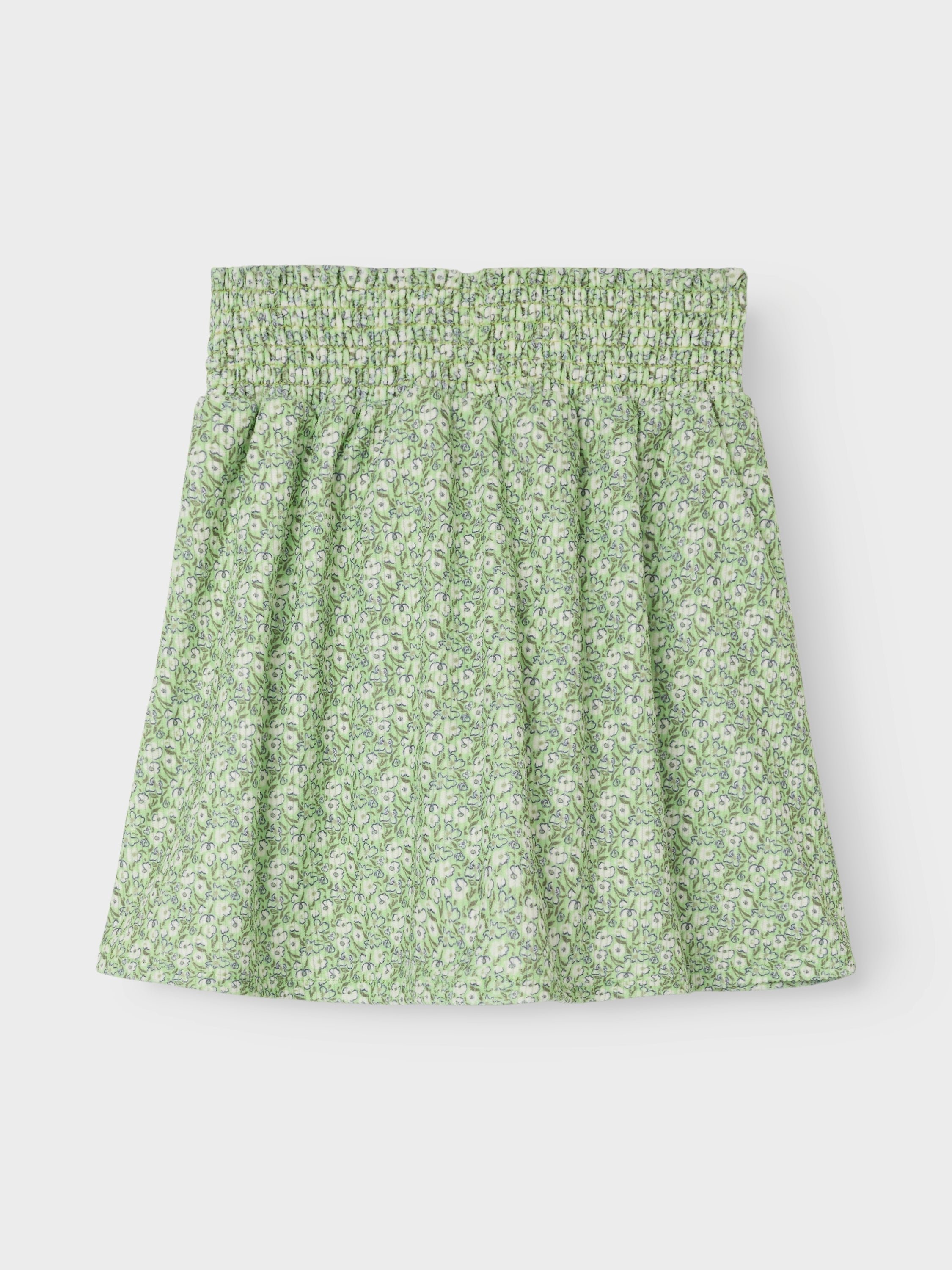 Jupe courte verte à motifs floraux. Nommez-la