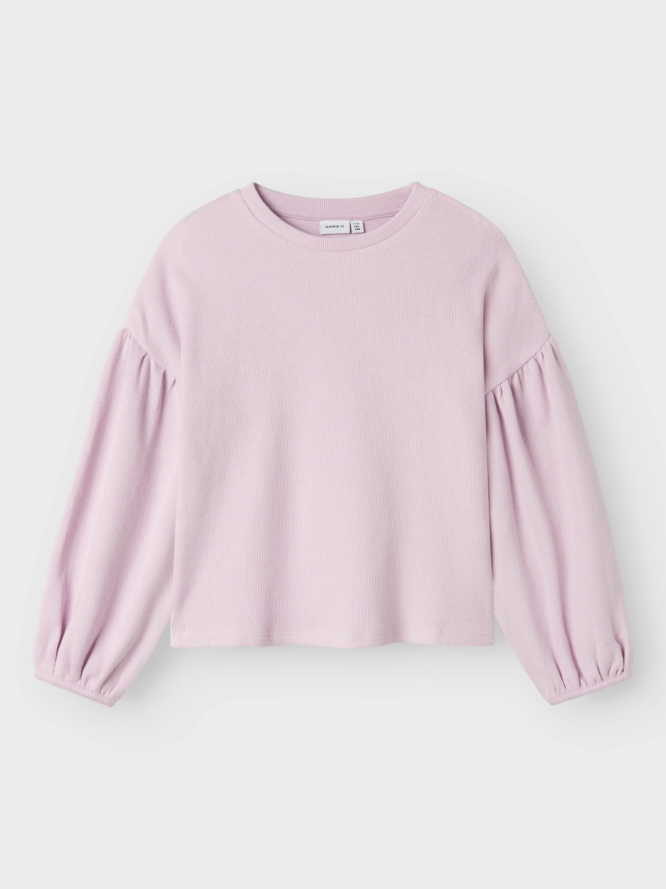 T-shirt rose en tissu côtelé à manches bouffantes. Nomme-le