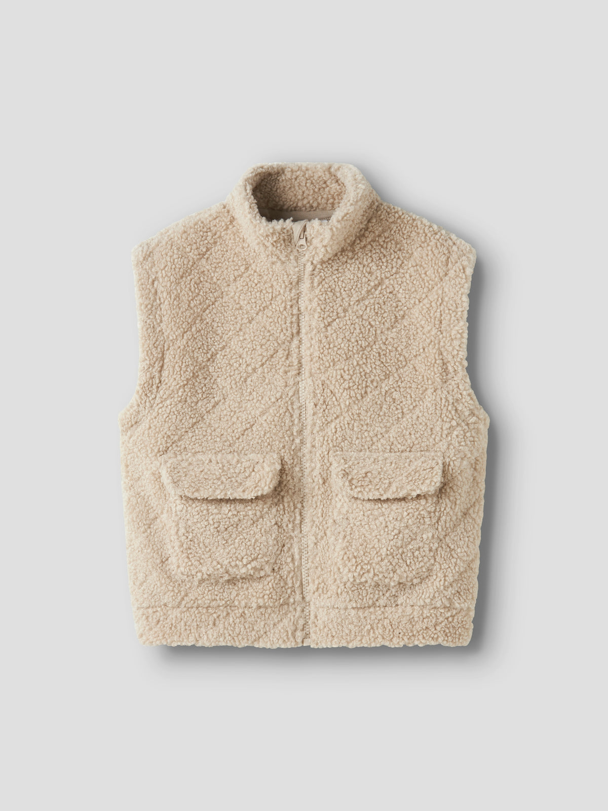 Beige bodywarmer in teddy stof met opgestikte zakken Name It